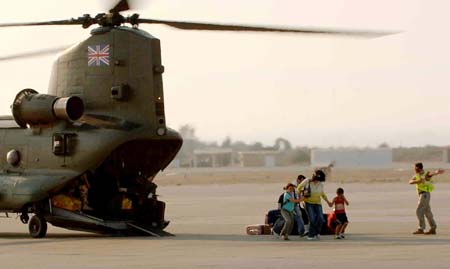 A handout picture released on July 18, 2006, by the Ministry of Defence shows Britons arriving at RAF Akrotiri in Cyprus on July 17, 2006, after being evacuated by RAF Chinook's from Beirut.