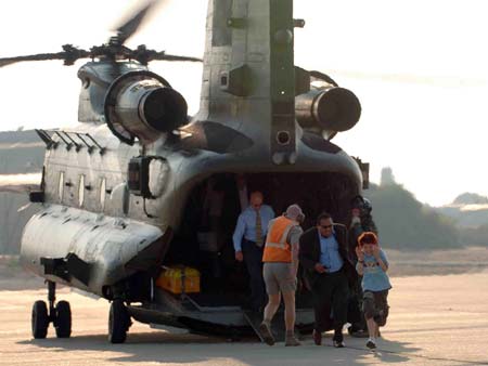 A handout picture released on July 18, 2006, by the Ministry of Defence shows Britons arriving at RAF Akrotiri in Cyprus on July 17, 2006, after being evacuated by RAF Chinook's from Beirut. 