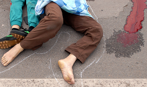 Victims of a traffic accident lie on the ground in Foshan, South Chinas Guangdong Province April 28 2005.