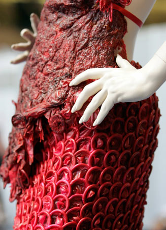 A dress made of condoms by Brazilian artist Adriana Bertini is on exhibit at the International AIDS conference in Toronto August 17, 2006. The exhibit aims to get people comfortable about condoms, especially those living in countries where the little piece of latex is considered taboo. [Reuters] 