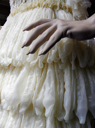 A dress made of condoms by Brazilian artist Adriana Bertini is on exhibit at the International AIDS conference in Toronto August 17, 2006. The exhibit aims to get people comfortable about condoms, especially those living in countries where the little piece of latex is considered taboo. [Reuters] 