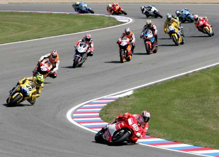 Ducati's Loris Capirossi of Italy (bottom) leads a pack of riders during the Czech Grand Prix at Masaryk's circuit in Brno August 20, 2006.