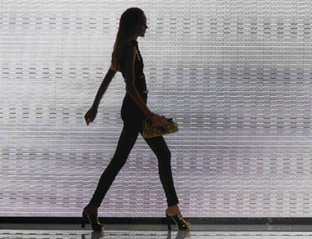 A model displays an outfit as part of Versace's Spring/Summer 2007 women's collections during Milan Fashion Week September 29, 2006.