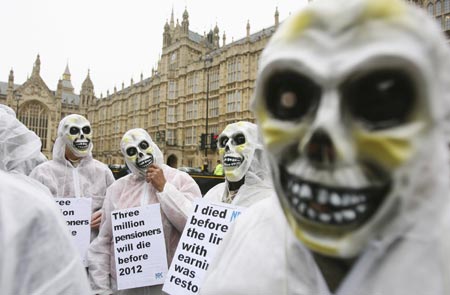 Pensioners, wearing skeleton masks, take part in a National Pensioners Convention lobby demonstration in central London October 25, 2006. The pensioners are calling for an immediate restoration of links with earnings, currently not due until 2012, to help pensioners who are currently struggling to pay bills. 