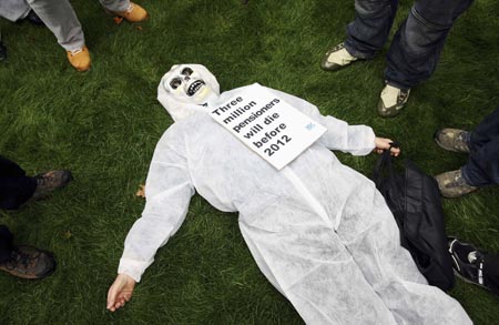 A pensioner, wearing a skeleton mask, takes part in a National Pensioners Convention lobby demonstration in central London October 25, 2006. The pensioners are calling for an immediate restoration of links with earnings, currently not due until 2012, to help pensioners who are currently struggling to pay bills. 