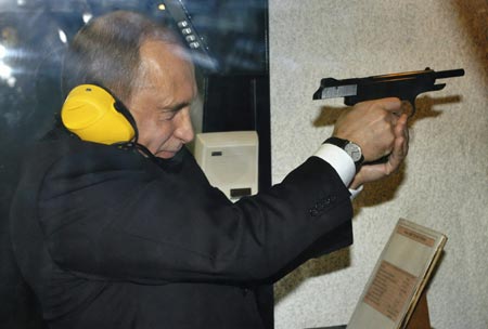 Russian President Vladimir Putin visits a shooting gallery of the new GRU military intelligence headquarters building in Moscow November 8, 2006. 