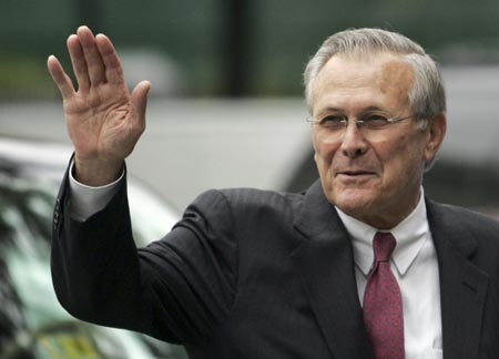 U.S. Secretary of Defense Donald Rumsfeld waves to well-wishers as he departs the White House after U.S. President George W. Bush announced Rumsfeld's replacement in Washington November 8, 2006. Rumsfeld, the controversial face of U.S. war policy, quit on Wednesday after Democrats rode Americans' anger and frustration over Iraq to victory in Tuesday's congressional elections.