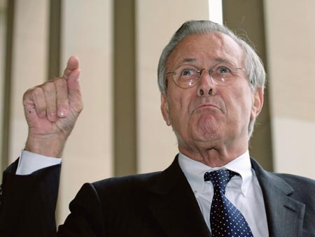 U.S. Secretary of Defense Donald Rumsfeld speaks with reporters outside of the Pentagon in Washington after a meeting with Singapore's Minister Mentor Lee Kuan Yew, October 17, 2006.