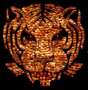 The head of a tiger made of 'turnip lamps', hollowed-out large white turnips decorated with transparent ornaments lit up by a candle burning inside, is paraded during the Raebechilbi (Turnip Fair) in the village of Richterswil on Lake Zurich, Switzerland, Saturday, Nov. 11, 2006. The age-old, rural custom of symbolically marking the transition from autumn to winter with lantern parades has become increasingly popular among children in Swiss cities. (AP Photo/Keystone, Walter Bieri) 