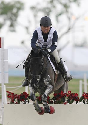 Kim Hyung-chil of South Korea, on Bundaberg Black, jumps during the Equestrian Cross Country event at the 15th Asian Games in Doha December 7, 2006. Kim was killed after falling off the horse. [Reuters]