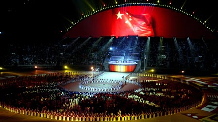 The Chinese flag is displayed on a screen at the Khalifa Stadium after the Asian Games flag was handed over to the city of Guangzhou during the closing ceremony of the 15th Asian Games in Doha December 15, 2006. 