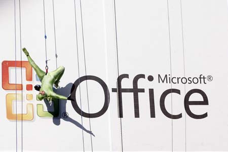 One of sixteen aerialists perform on a giant billboard at the the launch of Windows Vista and Microsoft Office in New York January 29, 2007. The performance featured an original score from the new Windows Vista soundtrack.