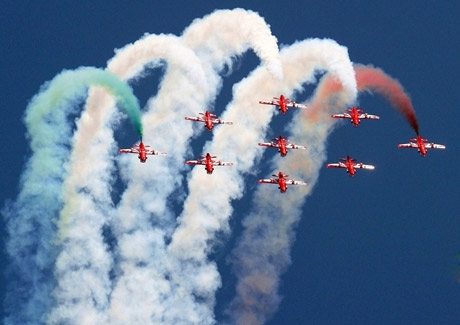 Pilots from the Surya-Kiran aerobatic demonstration team of the Indian Air Force perform during the 