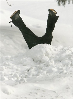 In fun, someone stood up this fake child's pants and sneakers in a tall snow drift after a heavy snowfall in Chagrin Falls, Ohio, Wednesday, Feb. 14, 2007. 