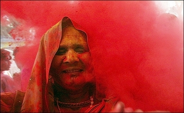 Barsana colors : An Indian woman gets her face smeared with gulal (coloured powder) during the Lathmar Holi festival in Barsana, some 100 km from New Delhi. 