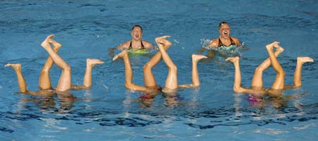 Members of the U.S. team perform in the synchronised swimming free combination routine preliminary round at the World Aquatics Championships at Rod Laver Arena in Melbourne March 17, 2007.