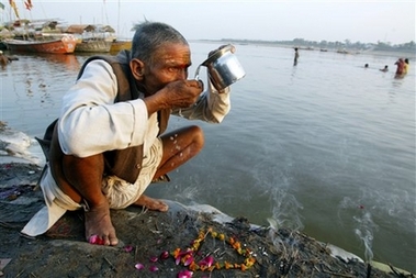 A Hindu devotee Jagdish Maharaj, 62, drinks polluted water from the Ganges River, as the world marks World Water Day, in Allahabad, India, Thursday, March 22, 2007. Maharaj said he has been drinking the water for the past 20 years. A report released by the World Wide Fund for Nature Tuesday lists the Ganges among the 'World's Top 10 Rivers at Risk,'' which are severely impacted by over-extraction and climate change and are dying fast.