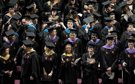 Virginia Tech graduate students wait before the graduate commencement ceremony at Cassell Coliseum on the campus of Virginia Tech in Blacksburg, Virginia May 11, 2007. Virginia Tech student Seung-Hui Cho killed 32 students and faculty members before killing himself on April 16 in the deadliest shooting in U.S. history. Some 3,600 seniors will graduate on Friday.