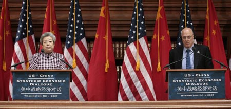 China's Vice Premier Wu Yi (L) and U.S. Treasury Secretary Henry Paulson deliver their statements at the conclusion of the U.S.-China Strategic Economic Dialogue in Washington May 23, 2007.