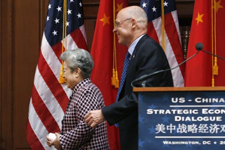U.S. Treasury Secretary Henry Paulson (R) and China's Vice Premier Wu Yi leave the podium after giving statements at the conclusion of the U.S.-China Strategic Economic Dialogue in Washington May 23, 2007. 