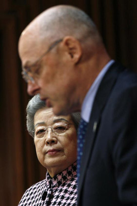 China's Vice Premier Wu Yi listens as U.S. Treasury Secretary Henry Paulson delivers a statement at the conclusion of the U.S.-China Strategic Economic Dialogue in Washington May 23, 2007.