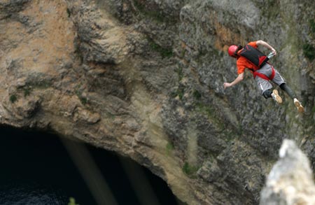 Slovenian base jumper Uros Ule jumps from a 250 meters (820 feet) high cliff, near Croatia's southern town of Imotski, May 24, 2007. Ule was one of 6 international base jumpers who jumped into Red Lake without any permit from the Croatian authorities. 