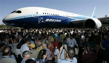The first production model of the new Boeing 787 Dreamliner airplane is unveiled to an audience of several thousand employees, airline executives, and dignitaries during a ceremony Sunday, July 8, 2007, at Boeing's assembly plant in Everett, Wash. [AP]