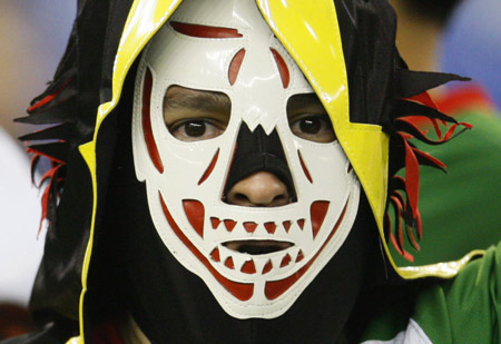 A fan of the Mexican soccer team cheers during their match against Congo in the Round of 16 match at the FIFA U-20 World Cup soccer tournament in Montreal, Quebec, July 12, 2007. 