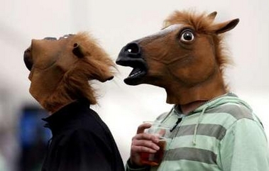 People with horse-head masks