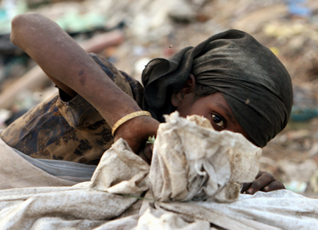 Indian children work in garbage dump