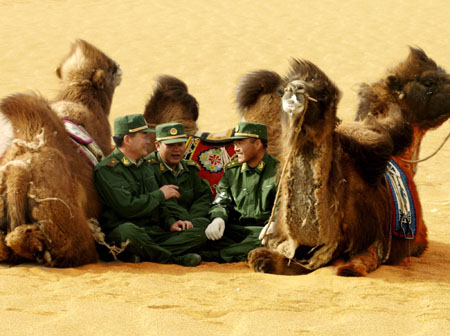 Chinese border soldiers patrol a desert