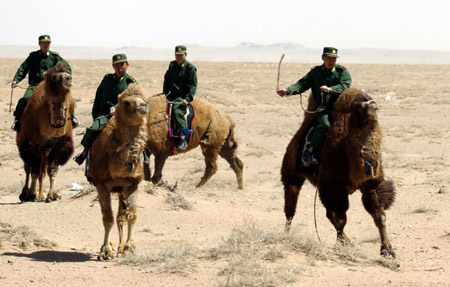 Chinese border soldiers patrol a desert