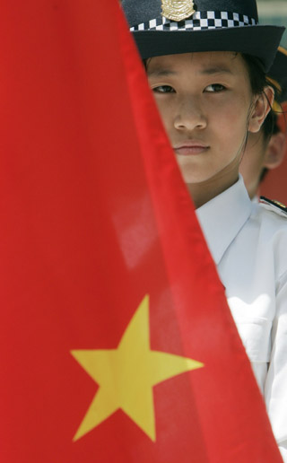 Students rehearse raising national flag