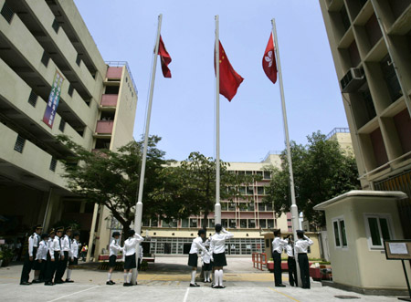 Students rehearse raising national flag