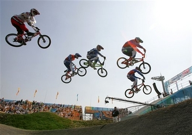 Riders clear a jump during a semi-final at the UCI BMX Supercross World Cup at Laoshan Bicycle Moto Cross (BMX) venue in Beijing August 21,2007. The race is one of 26 test events being held at the venues which will be used for the 2008 Olympic Games.[AP]