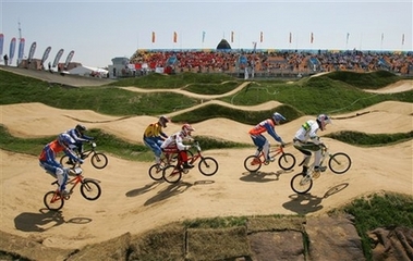 Riders compete during a quarterfinal at the UCI BMX Supercross World Cup at Laoshan Bicycle Moto Cross (BMX) venue in Beijing August 21,2007. The race is one of 26 test events being held at the venues which will be used for the 2008 Olympic Games.[AP]