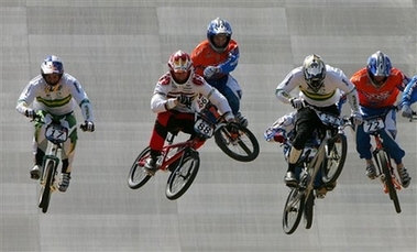 Riders clear a jump during a men's quarterfinal at the UCI Bicycle Motocross (BMX) Supercross World Cup at at Laoshan Bicycle Moto Cross (BMX) venue in Beijing August 21,2007. [AP]