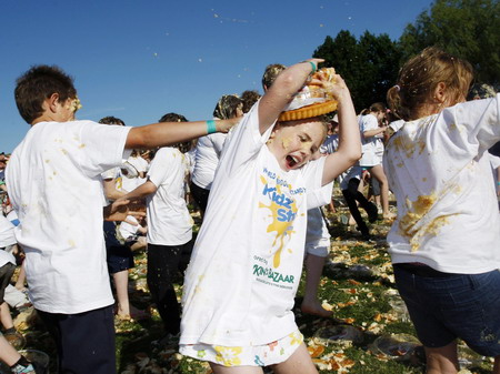 Children fight a merry custard pie fight