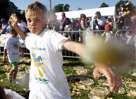 Children fight a merry custard pie fight