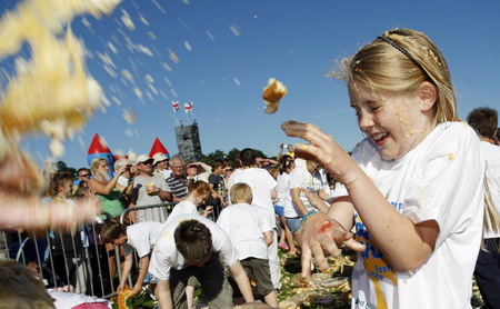 Children fight a merry custard pie fight