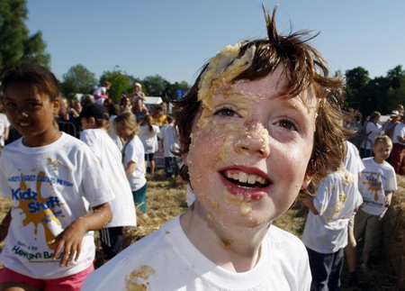 Children fight a merry custard pie fight