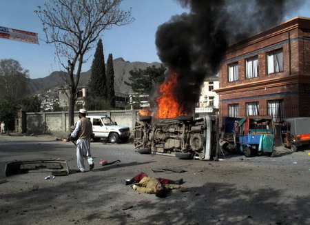 Suicide bombs kill dozens in Pakistan