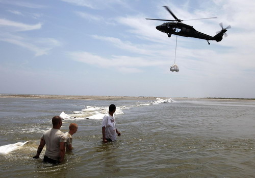 US shields coastline with oil containment boom