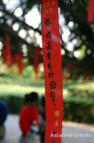 Students pray for luck in college exam at temple