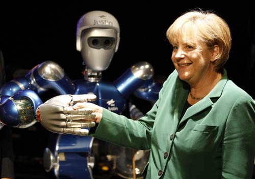 Merkel greets robot at Air Show