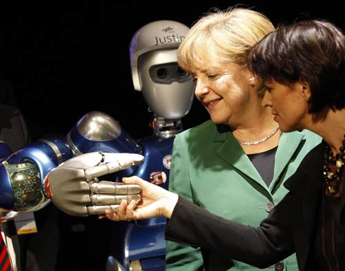 Merkel greets robot at Air Show