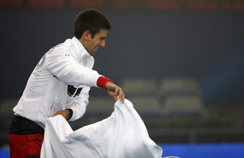 Rain postpones singles finals to Monday at China Open