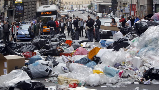 Stinky garbage piles in Naples street, Italy