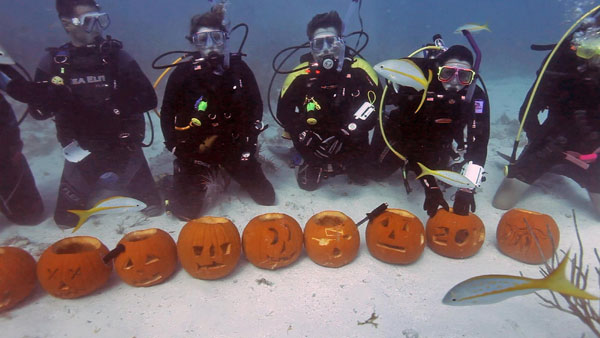 Carving Jack-o-Lanterns underwater