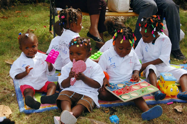 Haitian orphans join adoptive French families